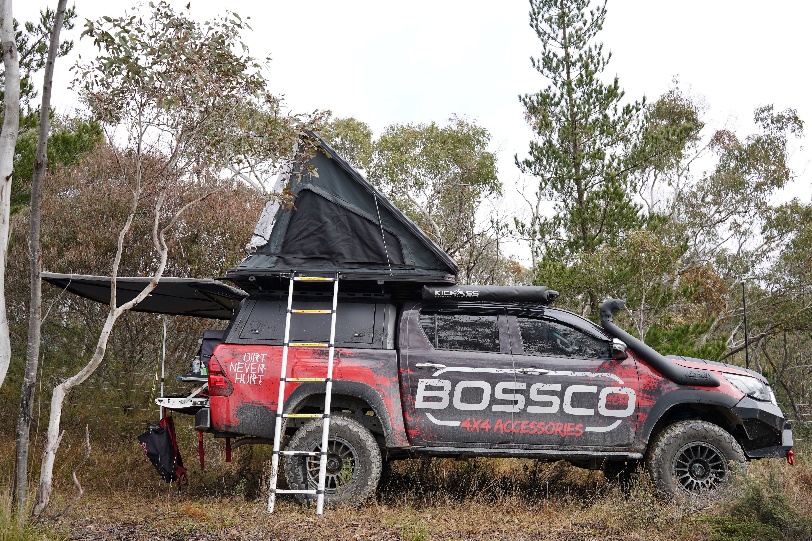 Bossco 4x4 Ute with canopy and awning parked at an off-road adventure.